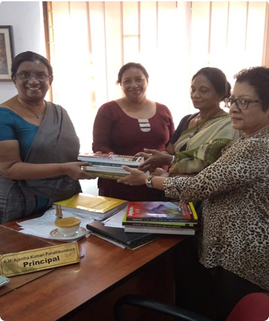 OGA Donating Books to school